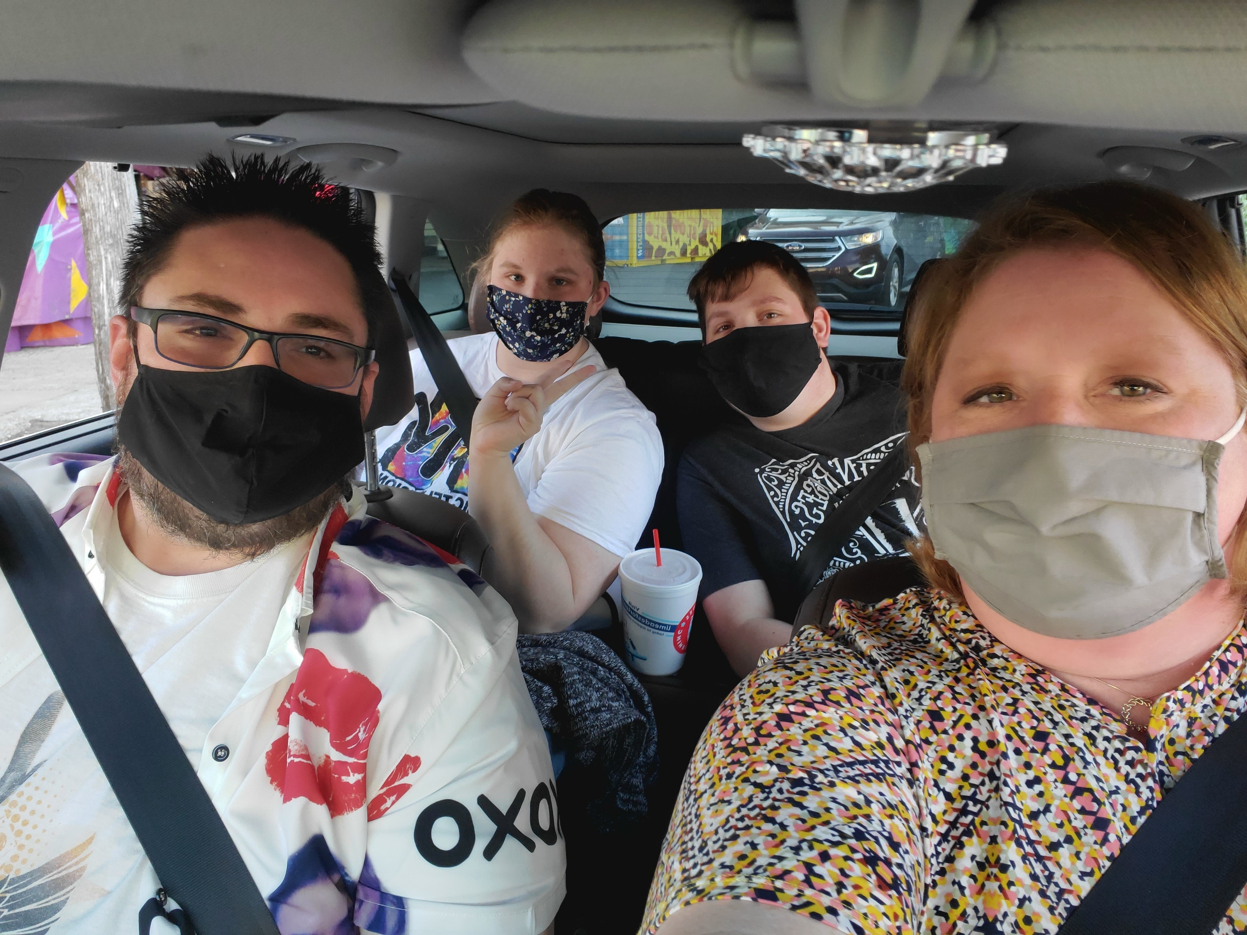 Big Dave & Family wearing masks in the car